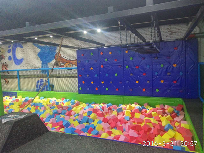 indoor trampoline park with climing wall
