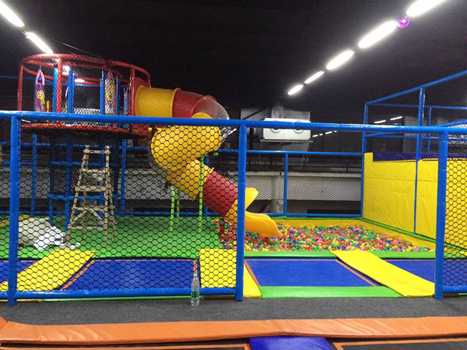 Indoor trampoline park with kids court